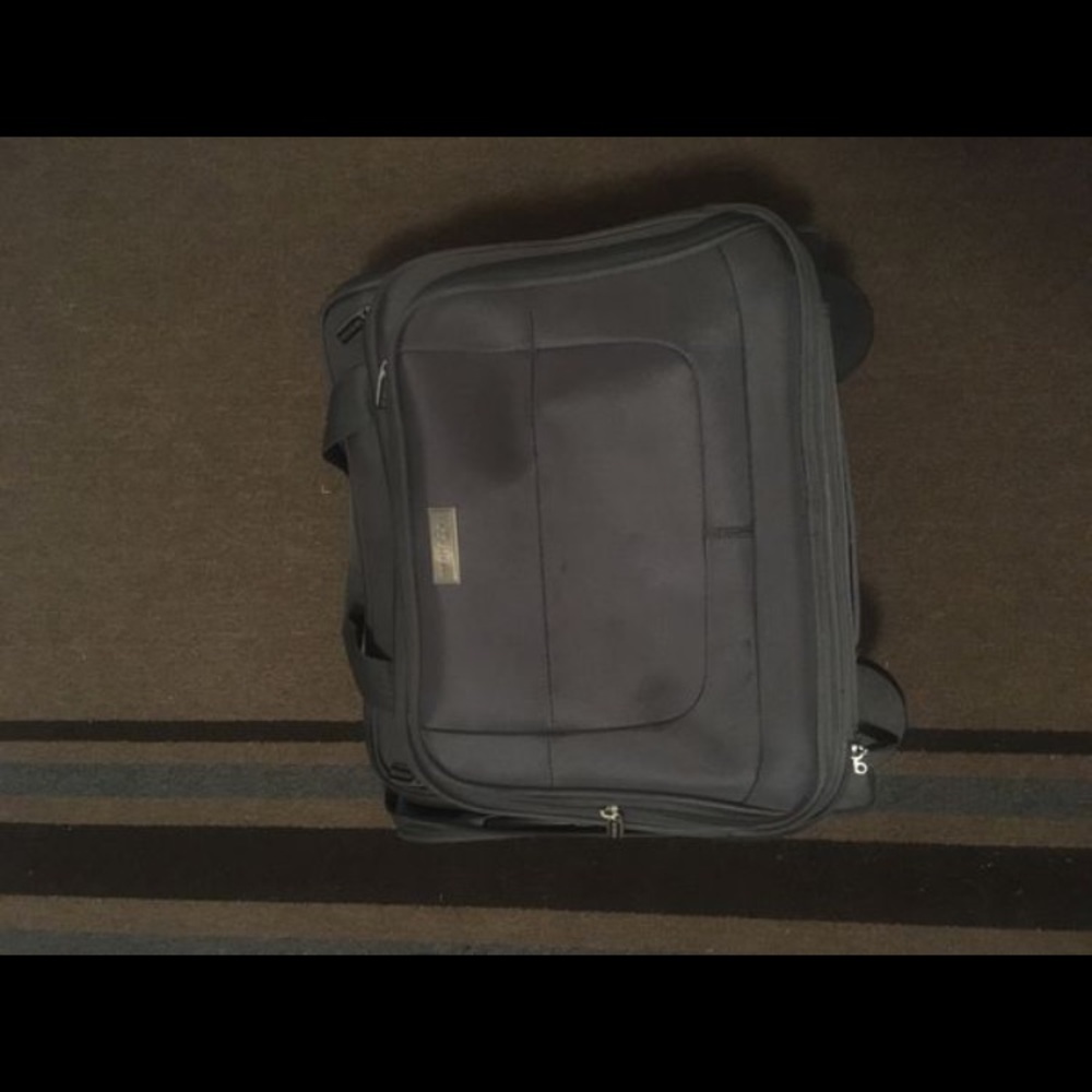 Grey rolling suitcase